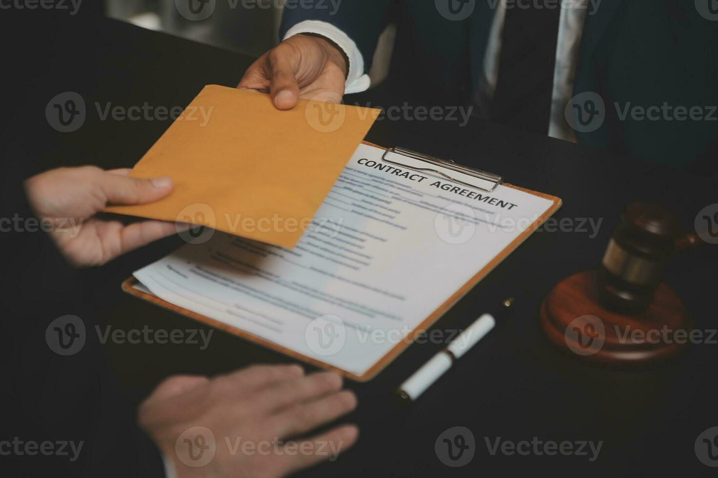 Business and lawyers discussing contract papers with brass scale on desk in office. Law, legal services, advice, justice and law concept picture with film grain effect photo