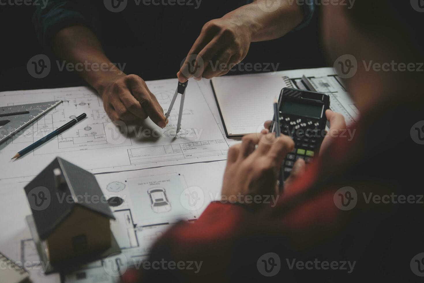 Engineer Teamwork Meeting, Drawing working on blueprint meeting for project working with partner on model building and engineering tools in working site, Construction and structure concept. photo