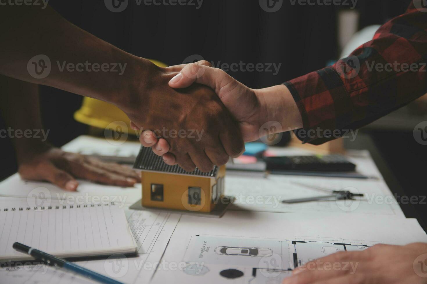 Engineer Teamwork Meeting, Drawing working on blueprint meeting for project working with partner on model building and engineering tools in working site, Construction and structure concept. photo