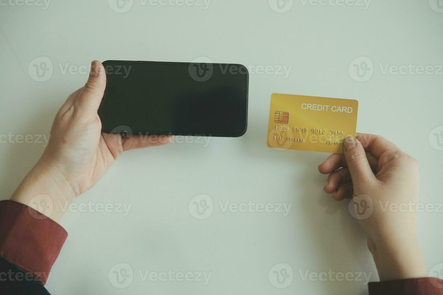 Woman hands holding and using cradit card for shopping online. photo
