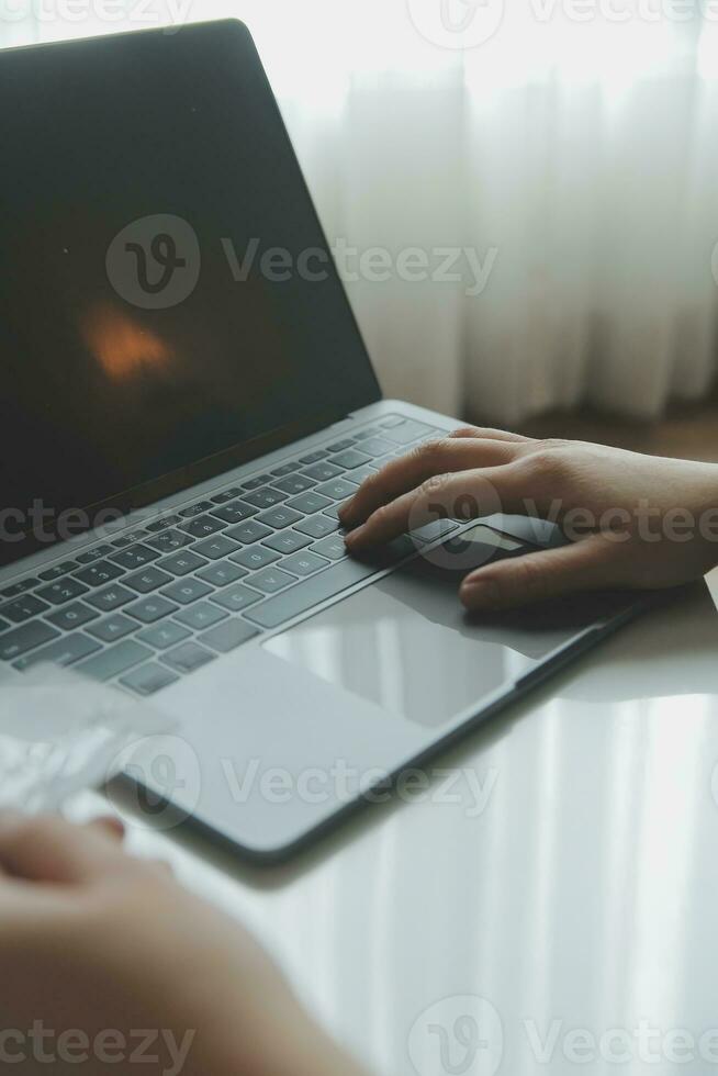 Woman hands holding and using cradit card for shopping online. photo