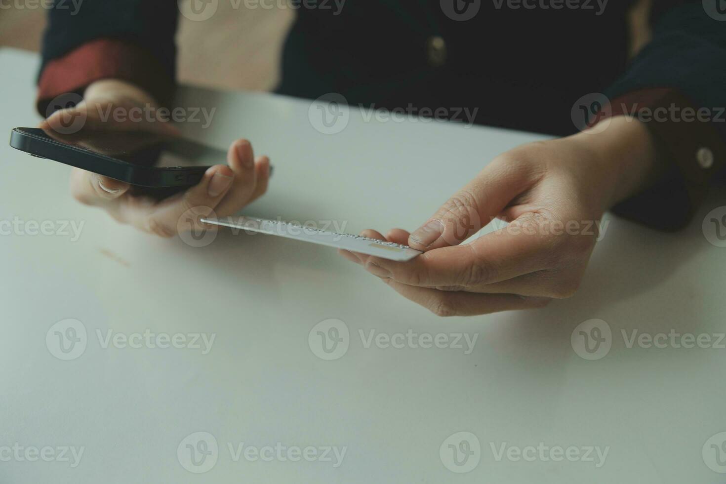 Woman hands holding and using cradit card for shopping online. photo