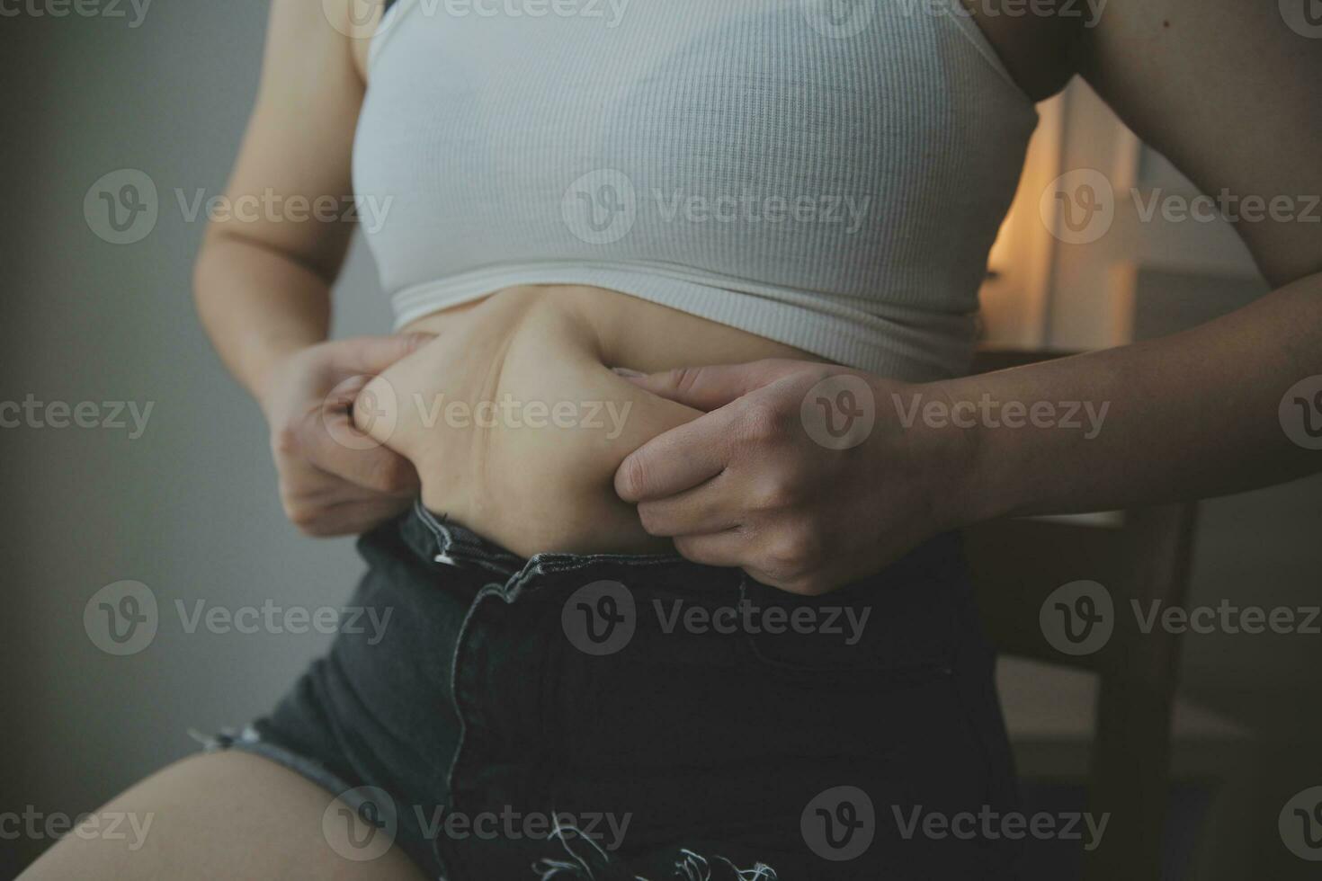 Fat woman measuring , fat woman fat belly chubby paunchy sport recreation health care lose belly fat do not exercise concept photo