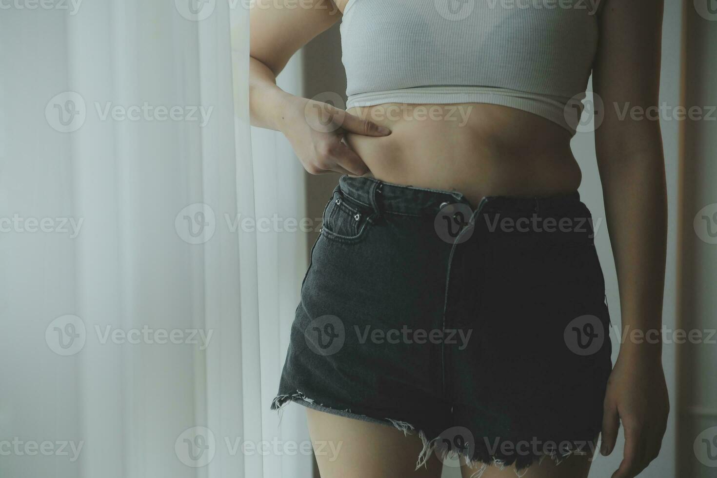 Fat woman measuring , fat woman fat belly chubby paunchy sport recreation health care lose belly fat do not exercise concept photo
