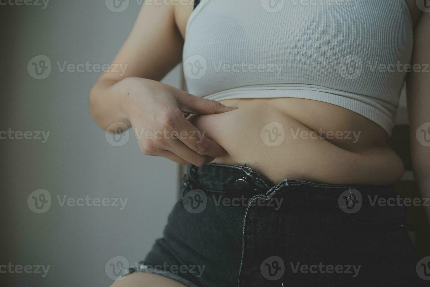 Fat woman measuring , fat woman fat belly chubby paunchy sport recreation health care lose belly fat do not exercise concept photo
