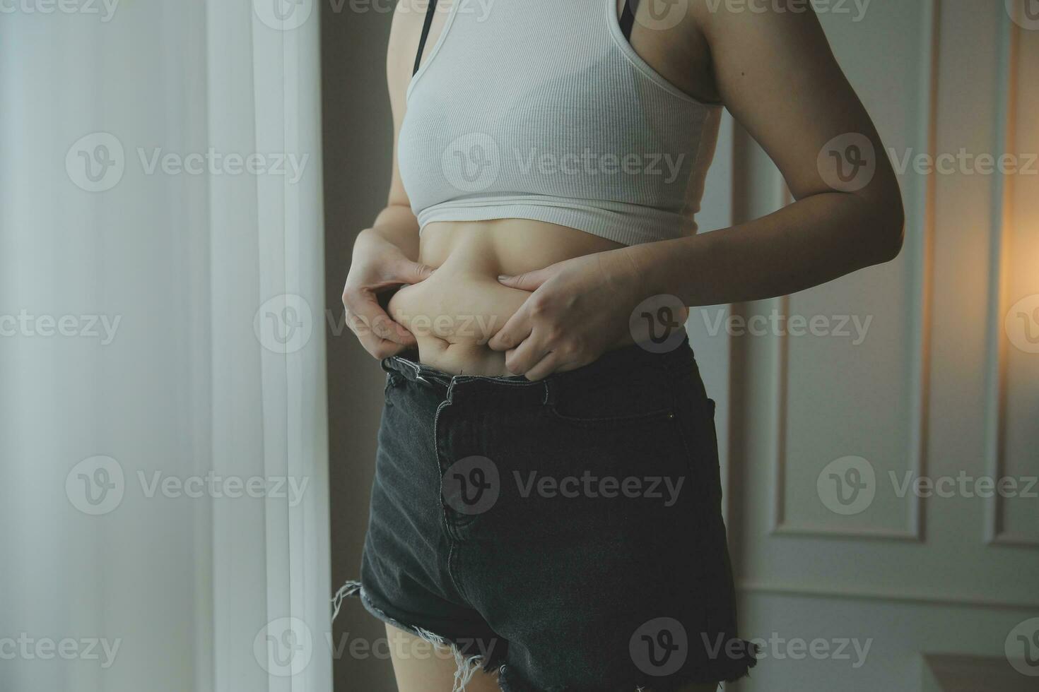 Fat woman measuring , fat woman fat belly chubby paunchy sport recreation health care lose belly fat do not exercise concept photo