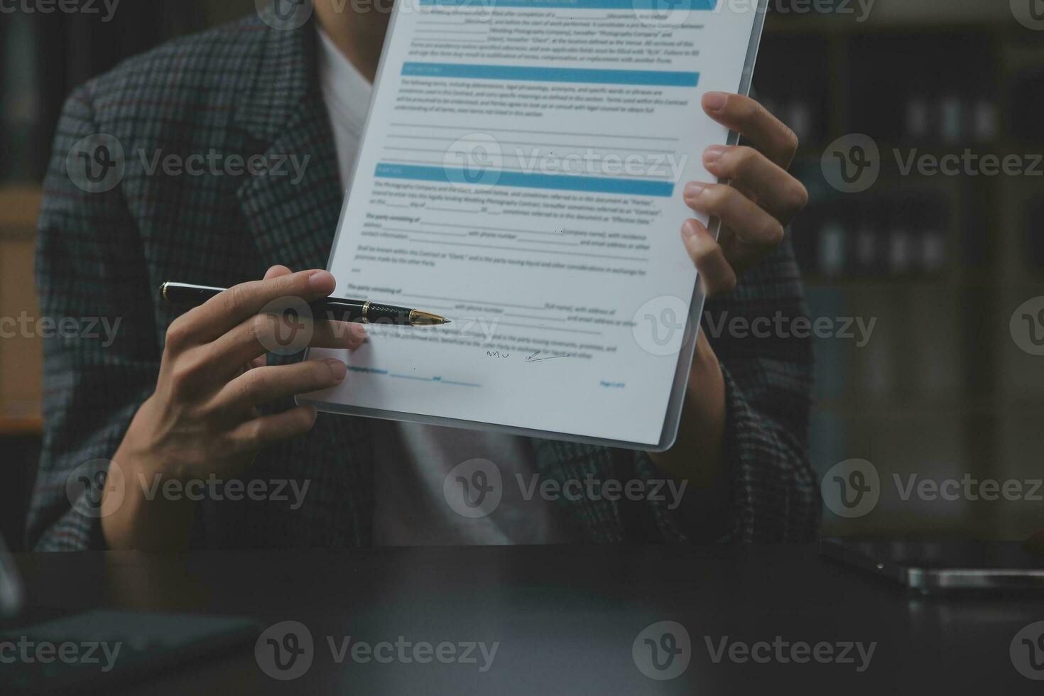 Business and lawyers discussing contract papers with brass scale on desk in office. Law, legal services, advice, justice and law concept picture with film grain effect photo