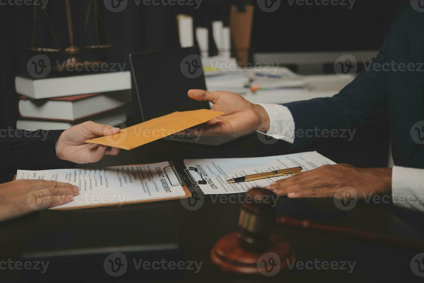 Business and lawyers discussing contract papers with brass scale on desk in office. Law, legal services, advice, justice and law concept picture with film grain effect photo