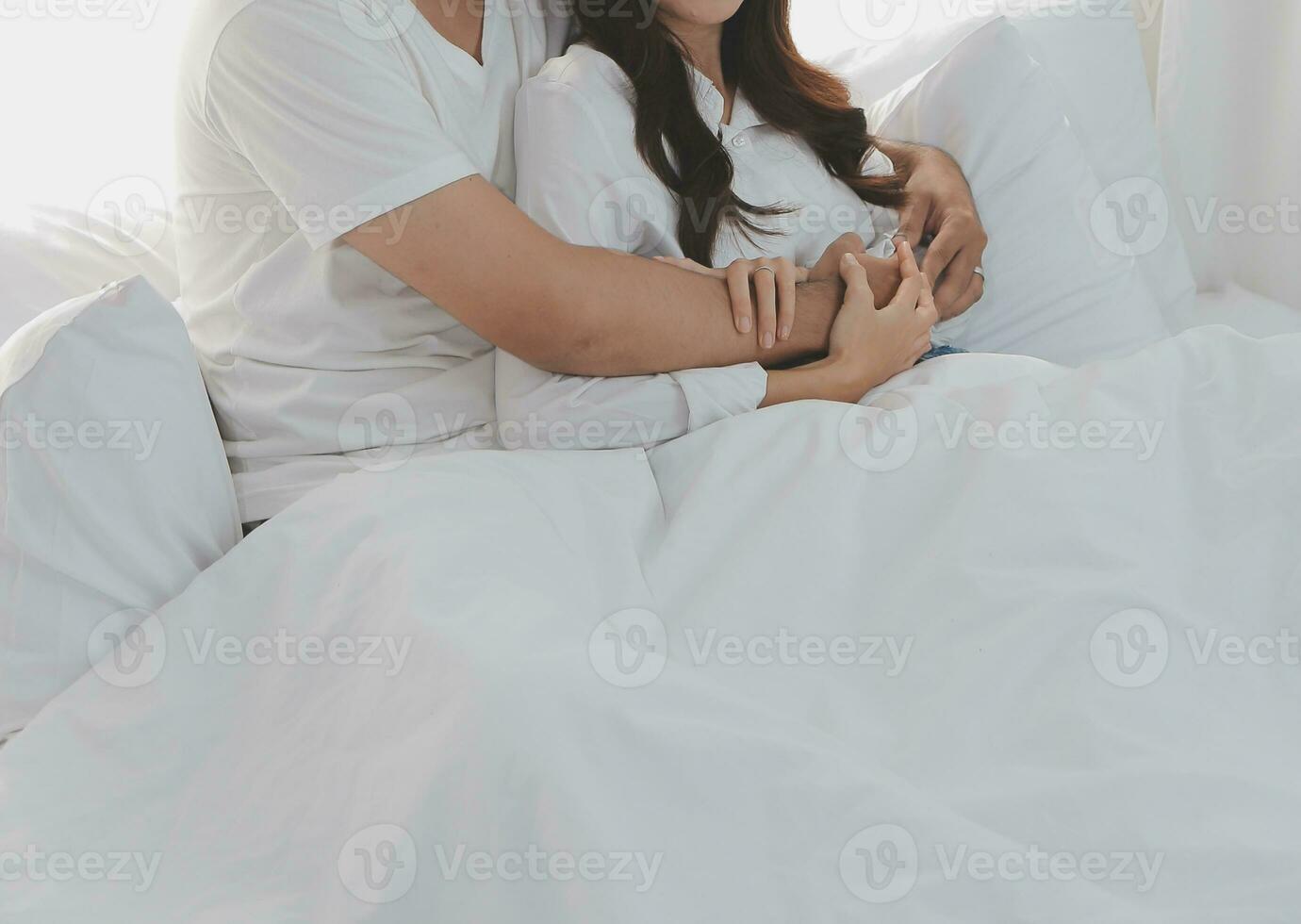 In love new couple at home.Cheerful beautiful young couple relexing on sofa home.Romantict moment.In selective focus. Setup studio shooting. photo