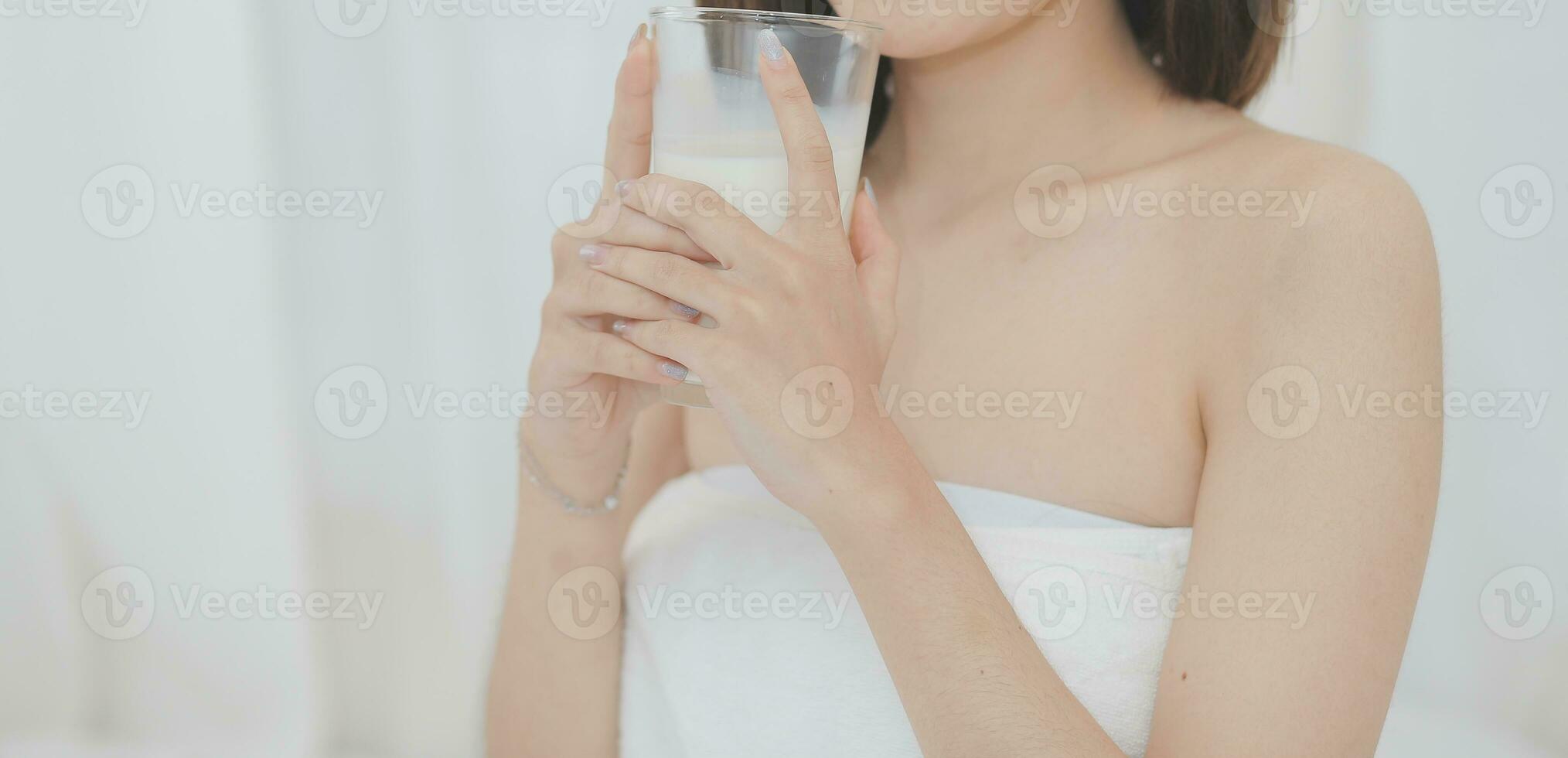 Young attractive girl Spanish appearance delighted with the surprise. And The Morning Started With An Unexpected Healthy Breakfast. In surprise, she waved her hands and rejoices at what is happening. photo