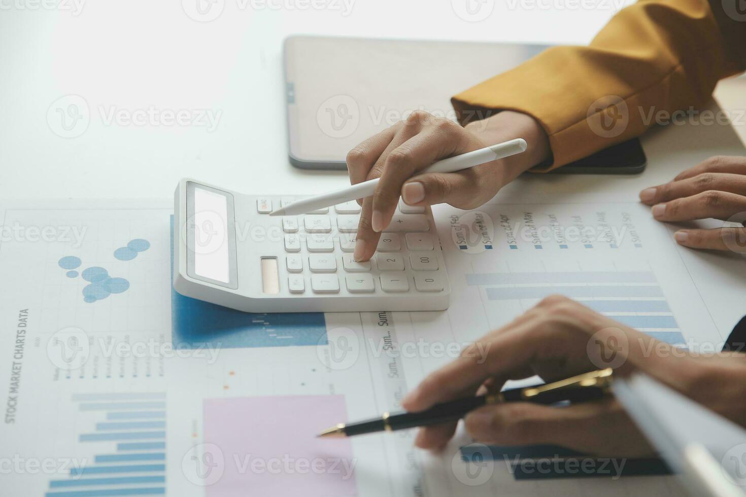 Accounting businessman working on laptop computer and analyzing real estate investment data, Financial and tax systems concept. photo