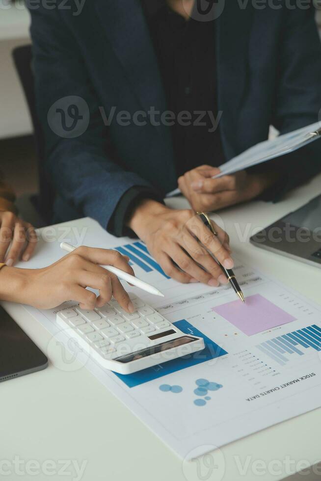 Financial Business team present. Business man hands hold documents with financial statistic stock photo, discussion, and analysis report data the charts and graphs. Finance Financial concept photo
