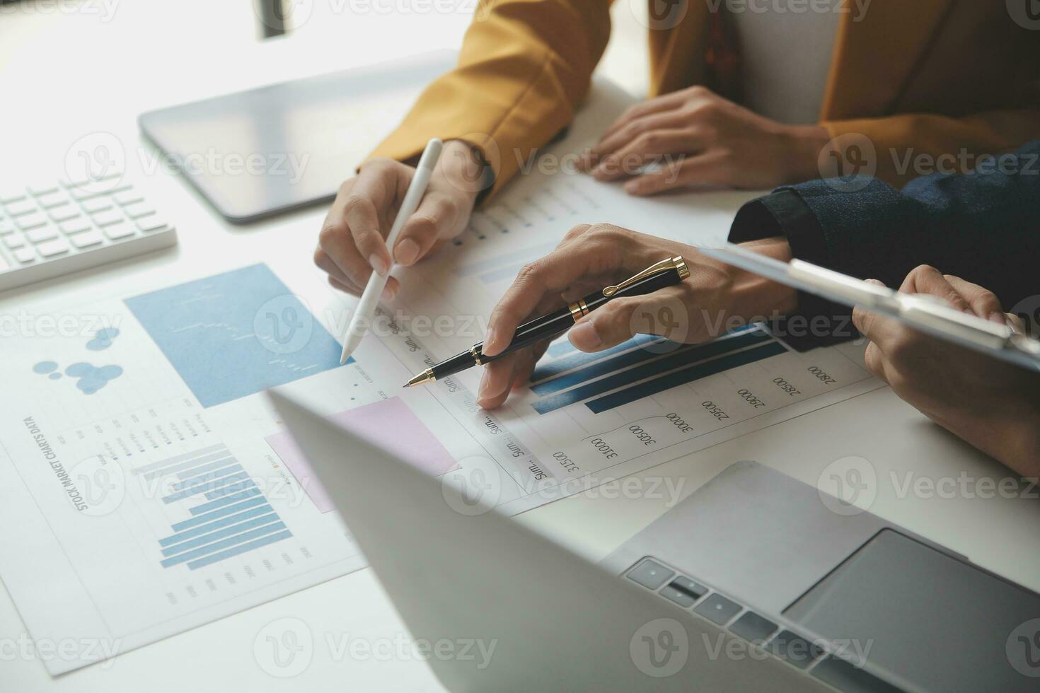 Financial Business team present. Business man hands hold documents with financial statistic stock photo, discussion, and analysis report data the charts and graphs. Finance Financial concept photo