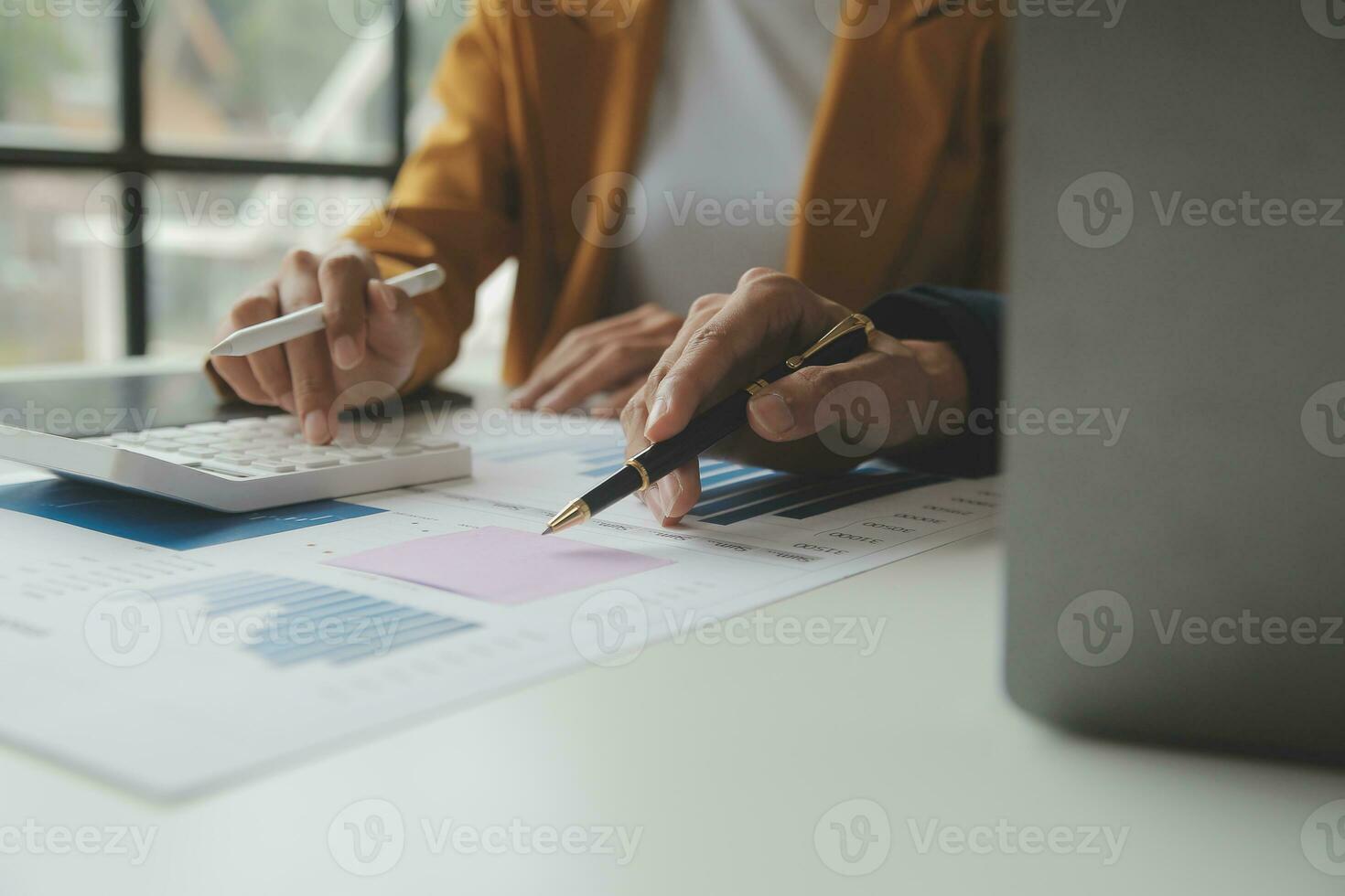 Accounting businessman working on laptop computer and analyzing real estate investment data, Financial and tax systems concept. photo