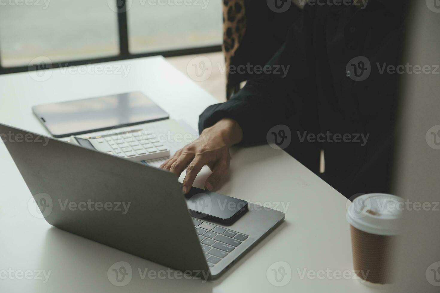 Entrepreneur Asian businessman and businesswoman discussing new business project in tablet in modern Meeting In Modern Office, Asian business casual concept. photo