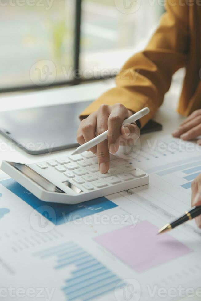 Accounting businessman working on laptop computer and analyzing real estate investment data, Financial and tax systems concept. photo