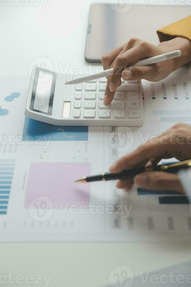 Accounting businessman working on laptop computer and analyzing real estate investment data, Financial and tax systems concept. photo