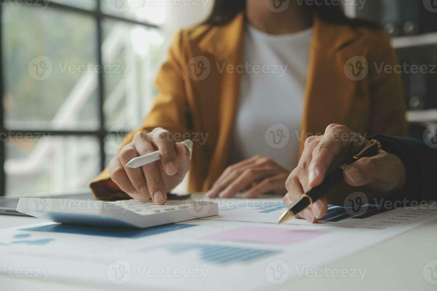 Accounting businessman working on laptop computer and analyzing real estate investment data, Financial and tax systems concept. photo