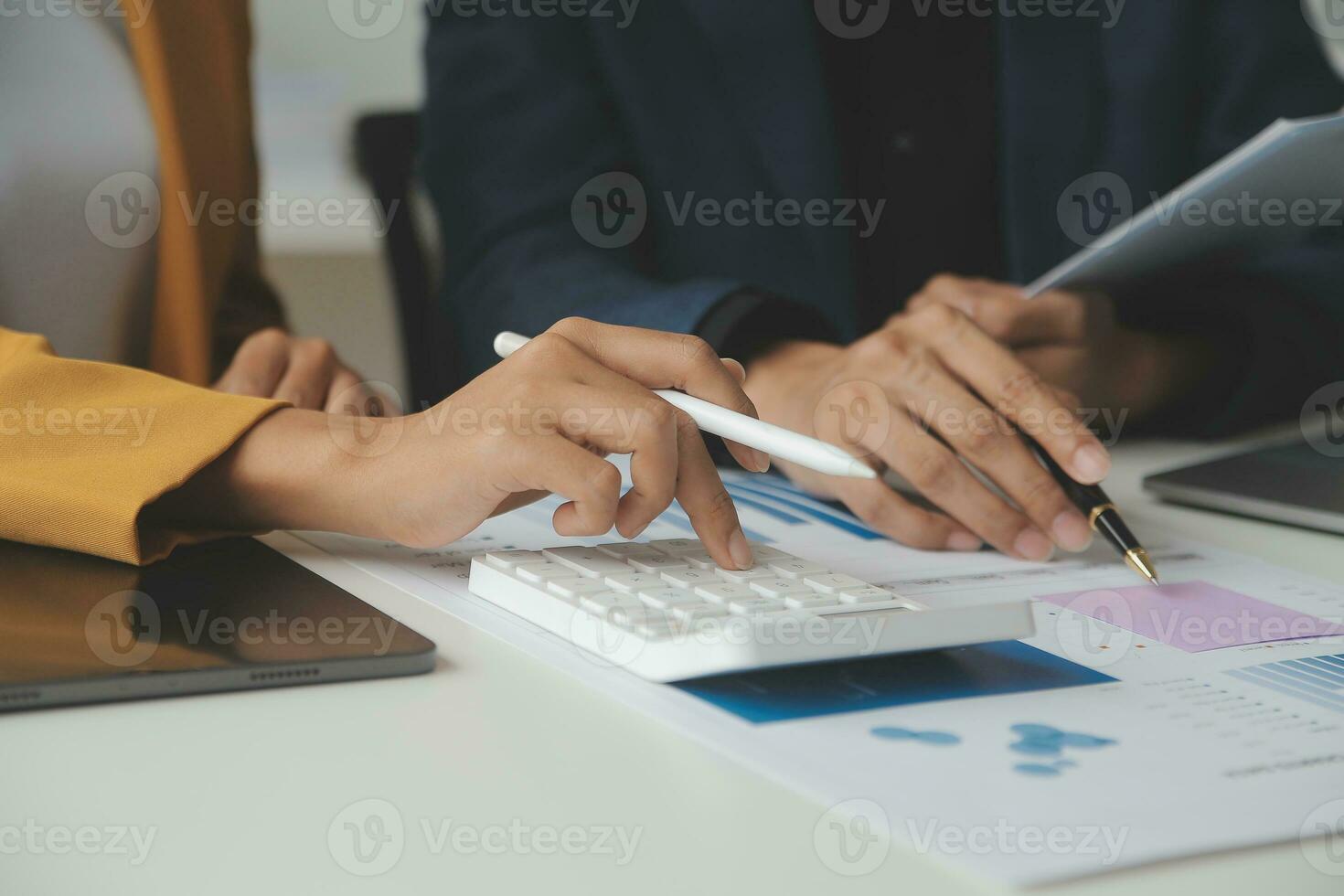 Financial Business team present. Business man hands hold documents with financial statistic stock photo, discussion, and analysis report data the charts and graphs. Finance Financial concept photo
