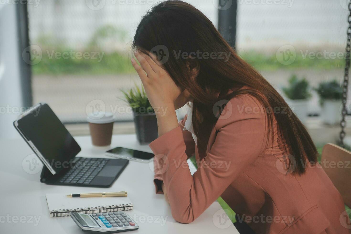 Entrepreneur Asian businessman and businesswoman discussing new business project in tablet in modern Meeting In Modern Office, Asian business casual concept. photo