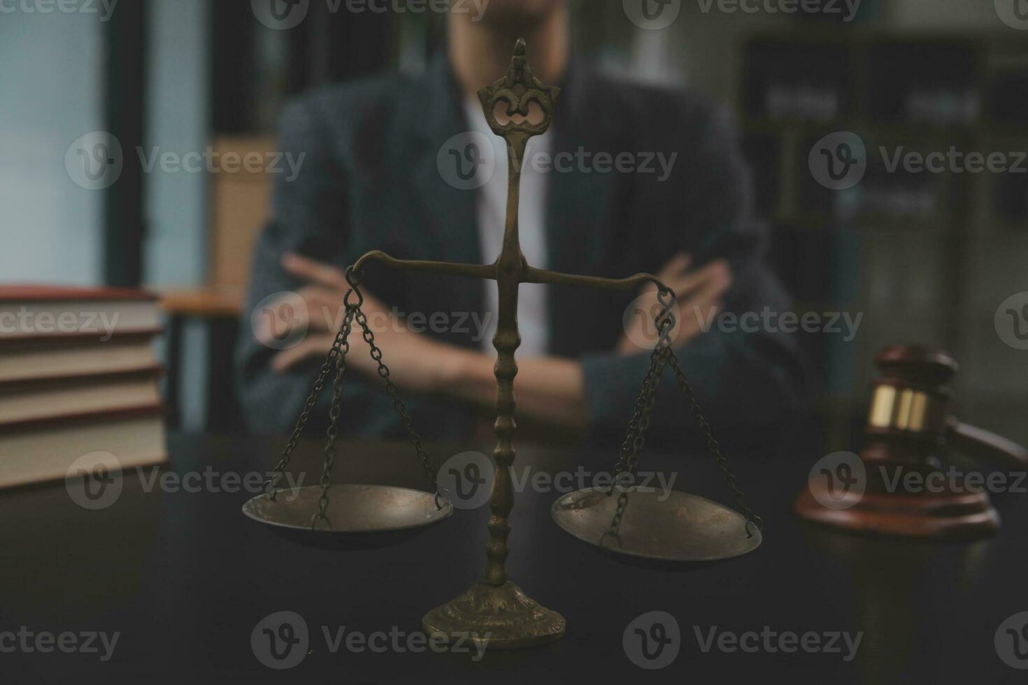 Business and lawyers discussing contract papers with brass scale on desk in office. Law, legal services, advice, justice and law concept picture with film grain effect photo