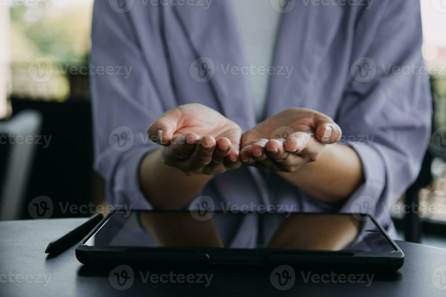 Asian Business woman using calculator and laptop for doing math finance on an office desk, tax, report, accounting, statistics, and analytical research concept photo