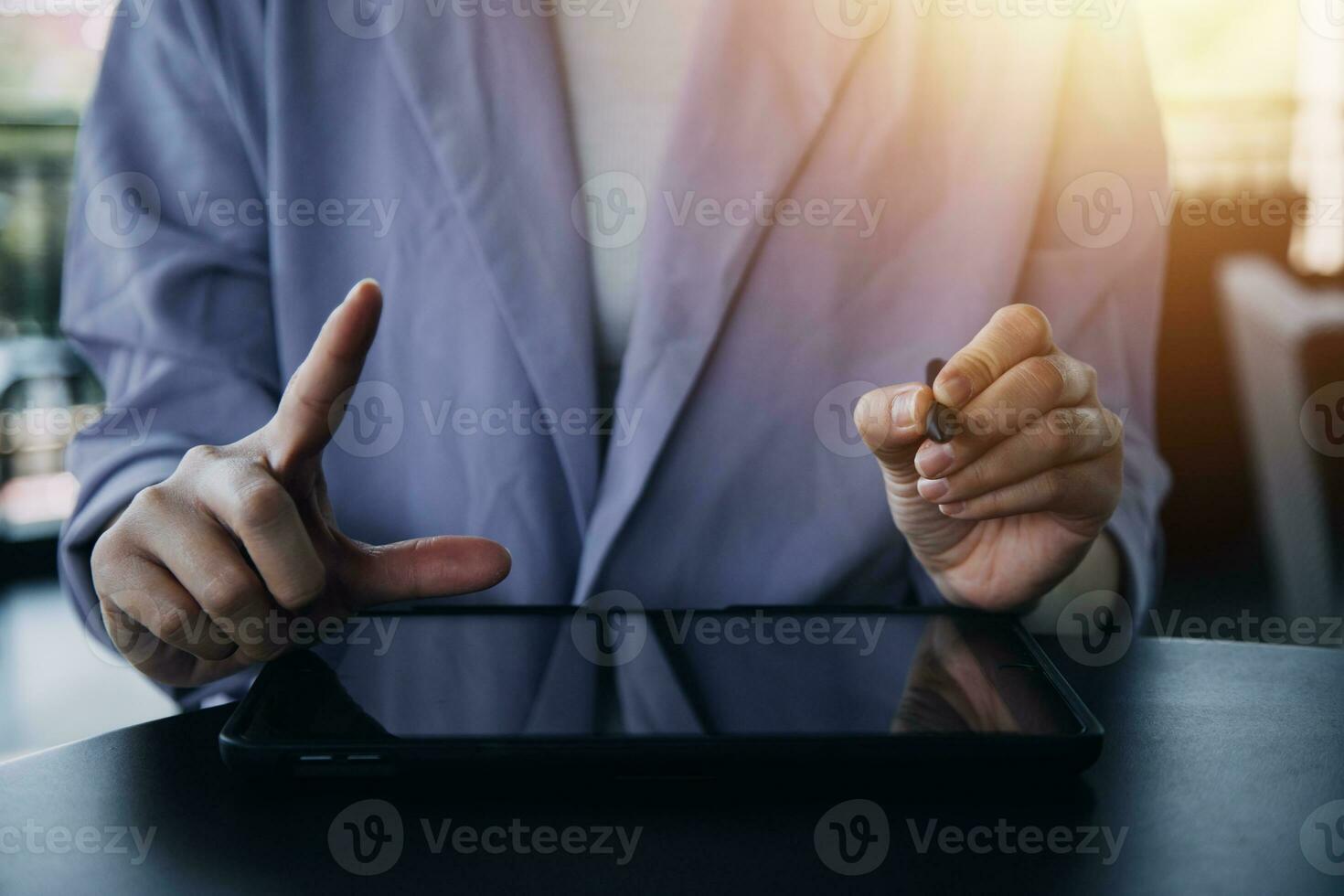 Asian Business woman using calculator and laptop for doing math finance on an office desk, tax, report, accounting, statistics, and analytical research concept photo