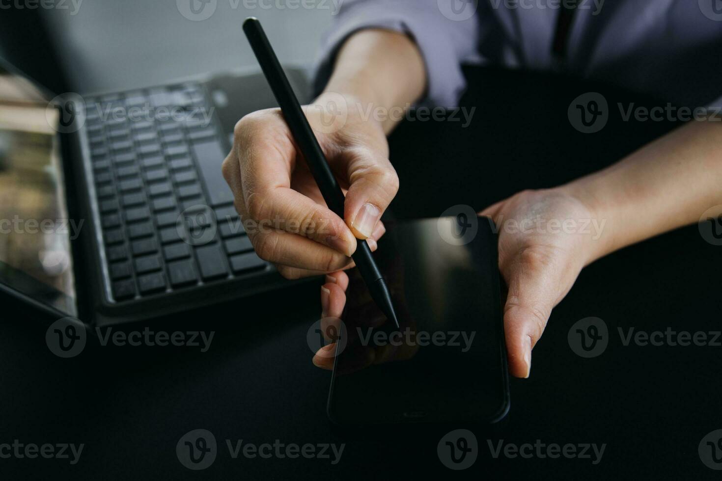 Asian Business woman using calculator and laptop for doing math finance on an office desk, tax, report, accounting, statistics, and analytical research concept photo