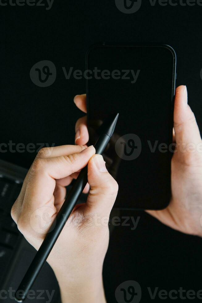 Asian Business woman using calculator and laptop for doing math finance on an office desk, tax, report, accounting, statistics, and analytical research concept photo