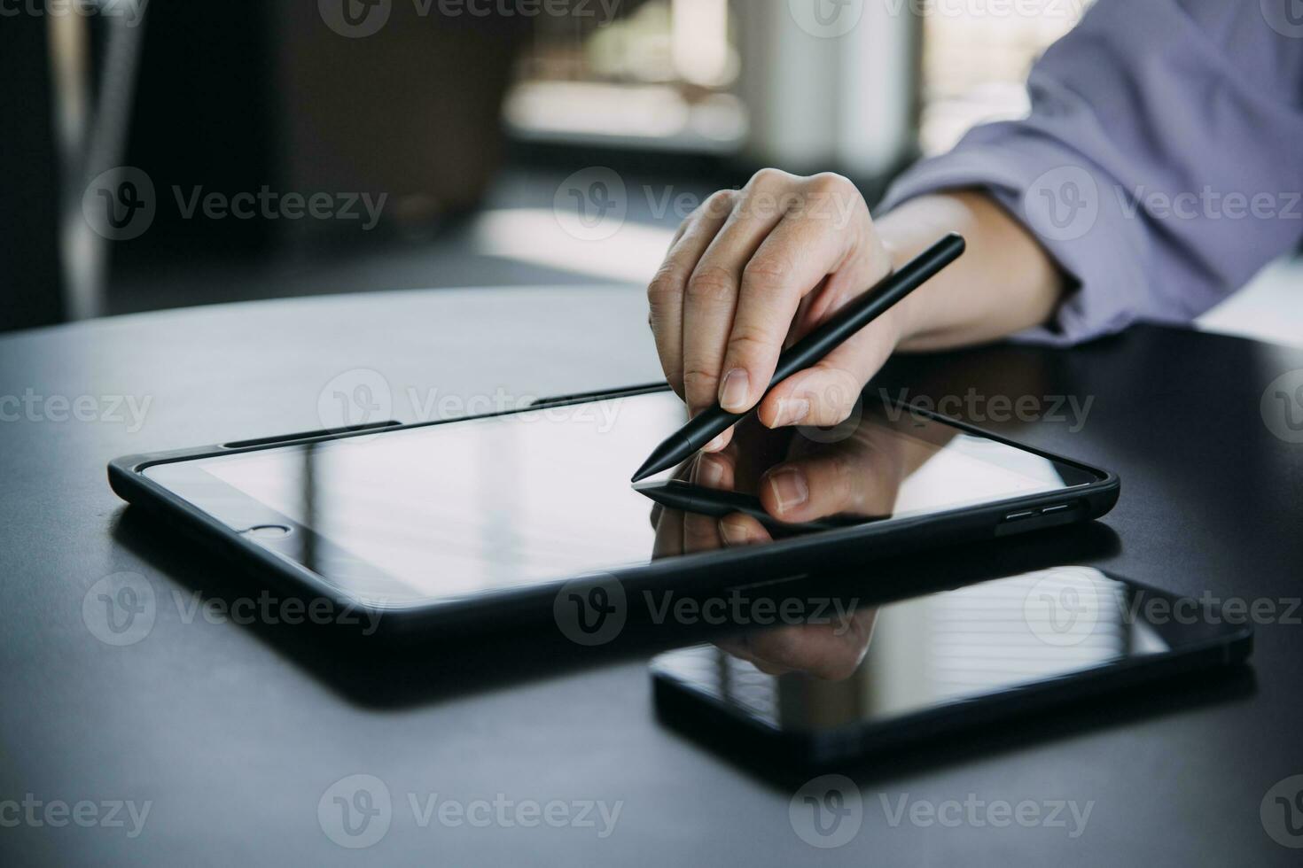 Asian Business woman using calculator and laptop for doing math finance on an office desk, tax, report, accounting, statistics, and analytical research concept photo