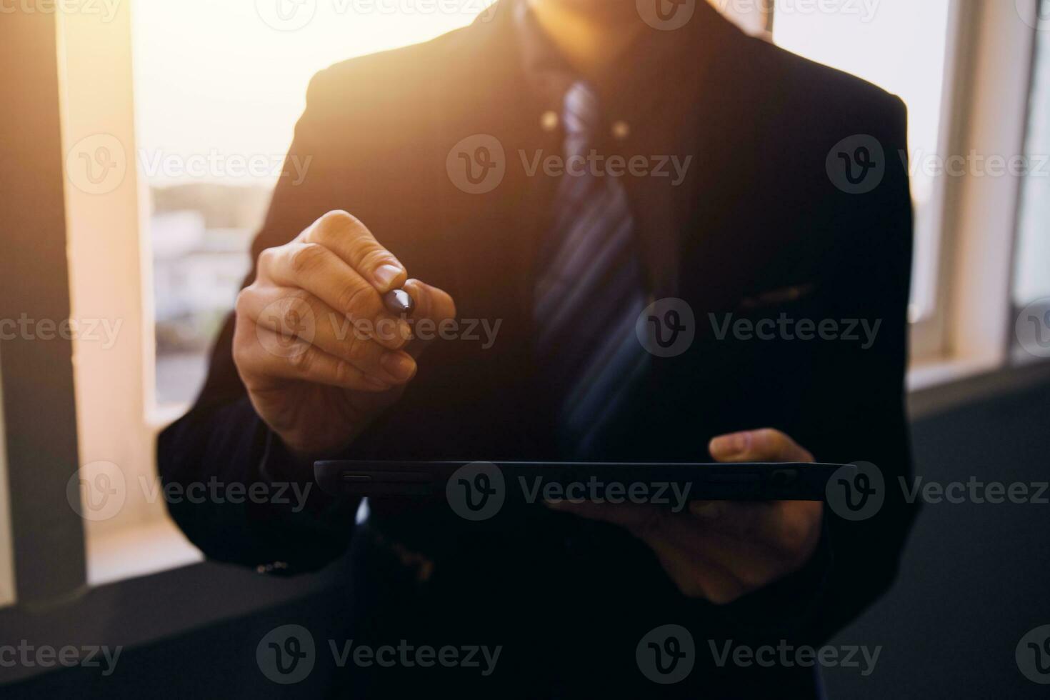 Asian Business woman using calculator and laptop for doing math finance on an office desk, tax, report, accounting, statistics, and analytical research concept photo