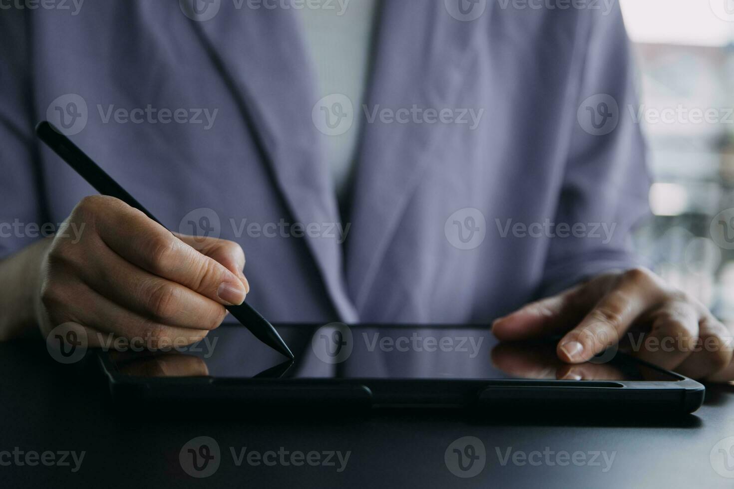 Asian Business woman using calculator and laptop for doing math finance on an office desk, tax, report, accounting, statistics, and analytical research concept photo