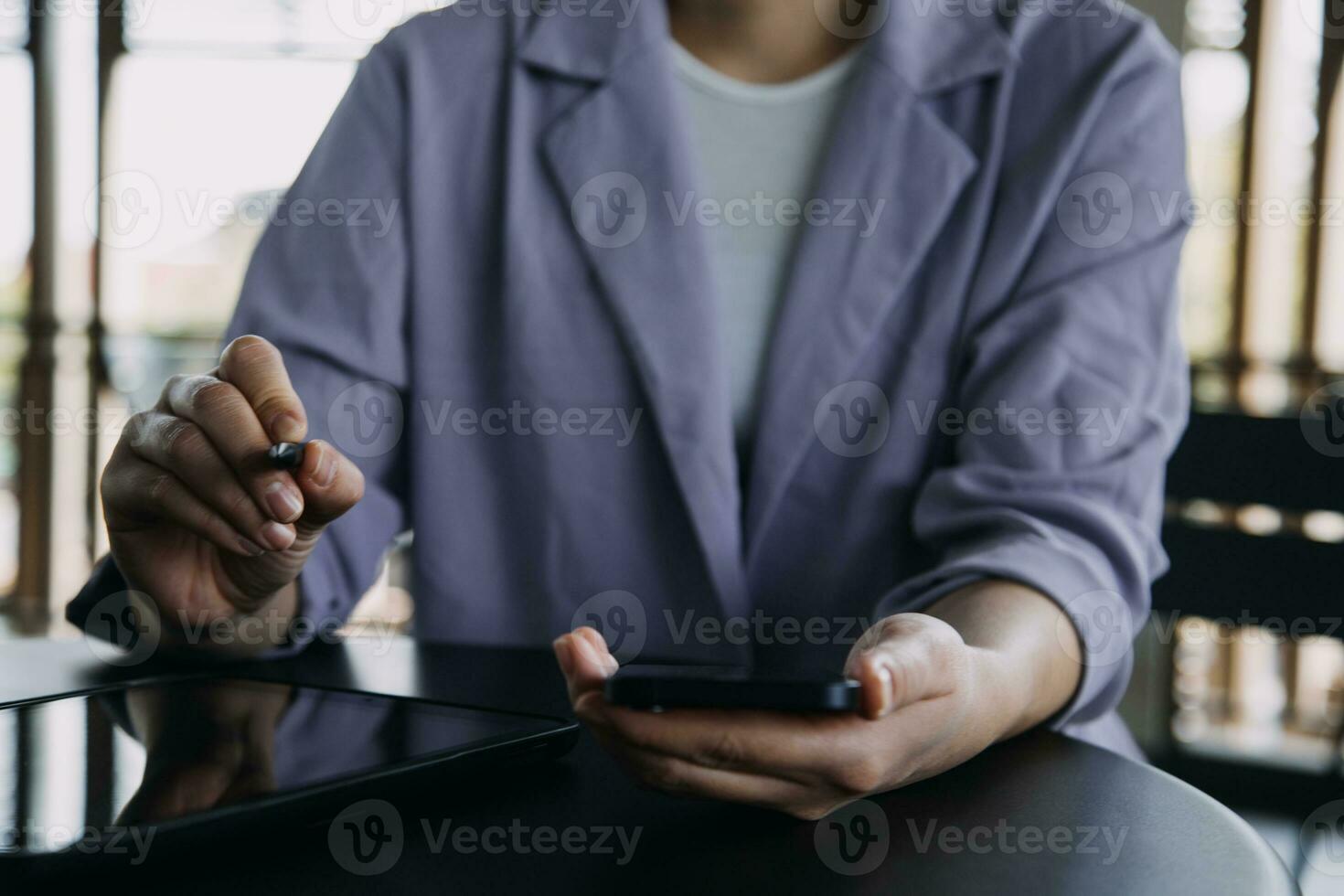 Asian Business woman using calculator and laptop for doing math finance on an office desk, tax, report, accounting, statistics, and analytical research concept photo