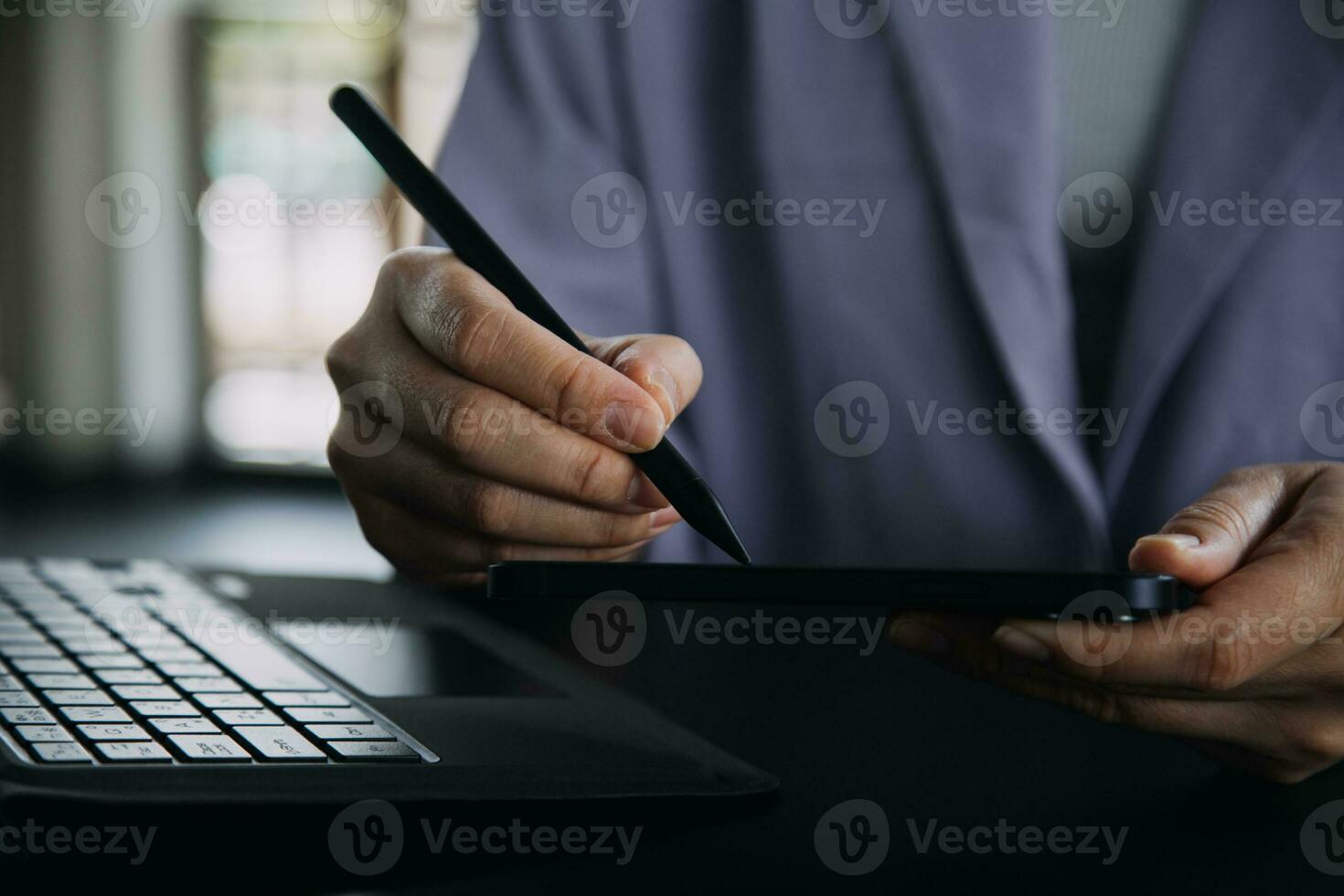 Asian Business woman using calculator and laptop for doing math finance on an office desk, tax, report, accounting, statistics, and analytical research concept photo