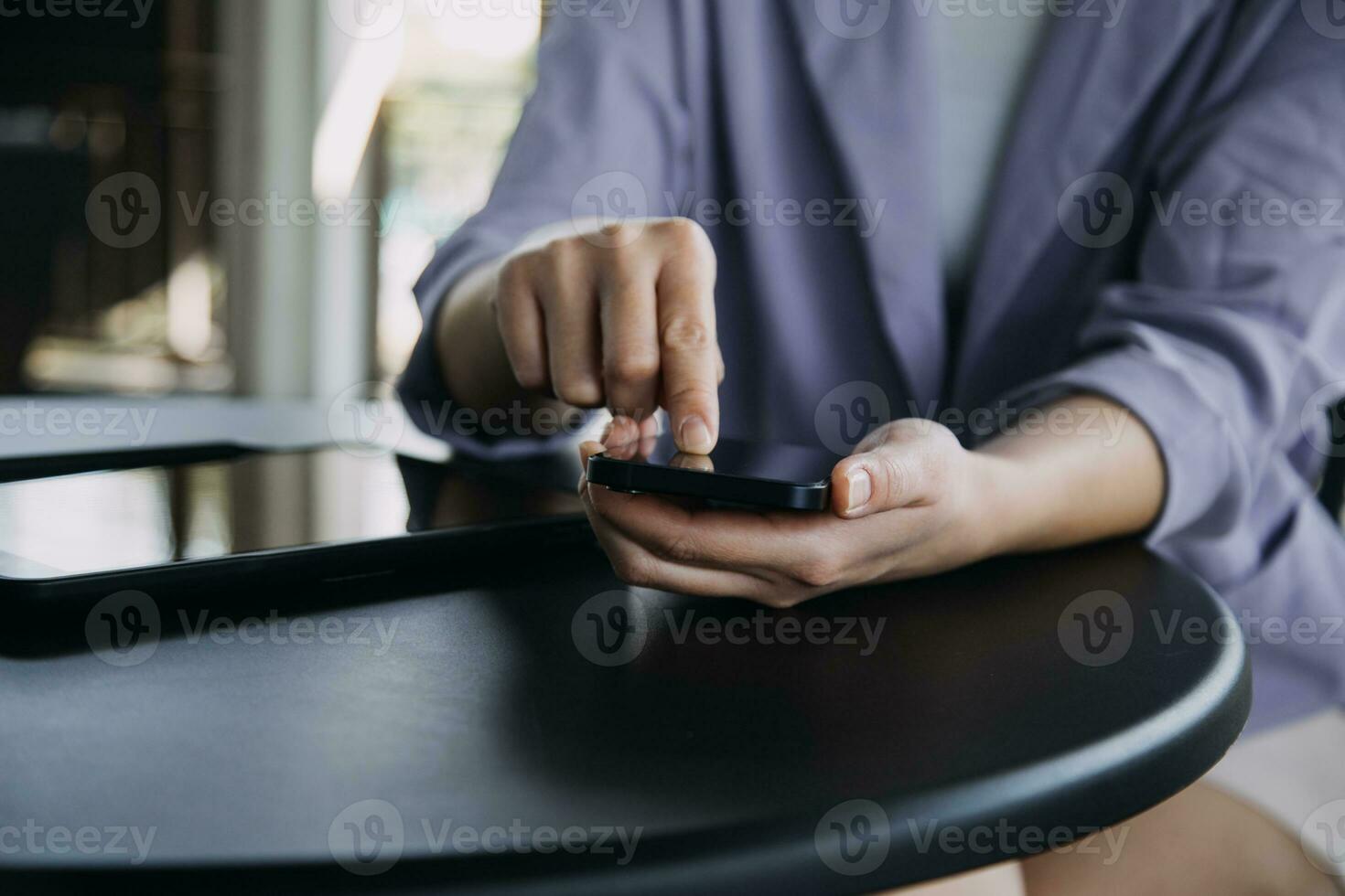 Asian Business woman using calculator and laptop for doing math finance on an office desk, tax, report, accounting, statistics, and analytical research concept photo