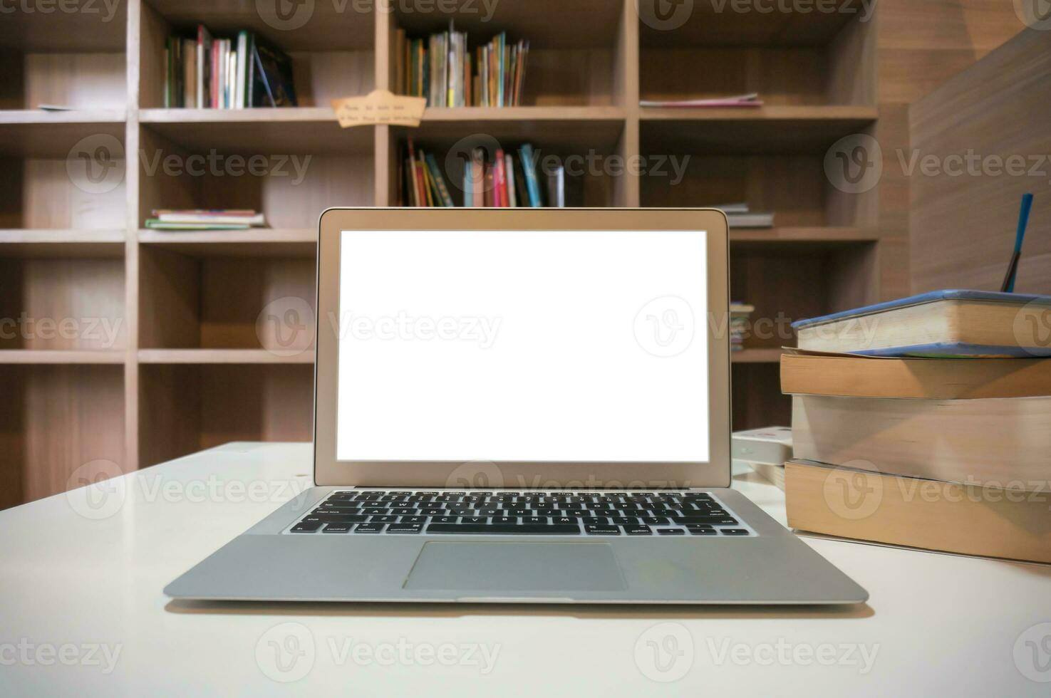 Laptop with Mock up blank screen on wooden table in front of cafe space for text. product display computer laptop montage- technology Freelance work concept photo
