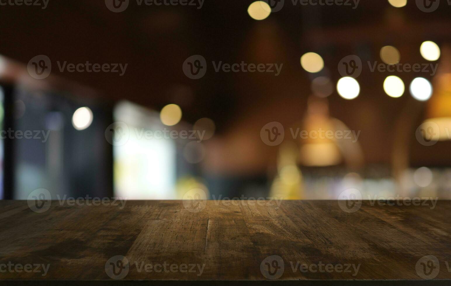 Wood table top in front of abstract blurred background. Empty wooden table space for text marketing promotion. blank wood table surface copy space photo