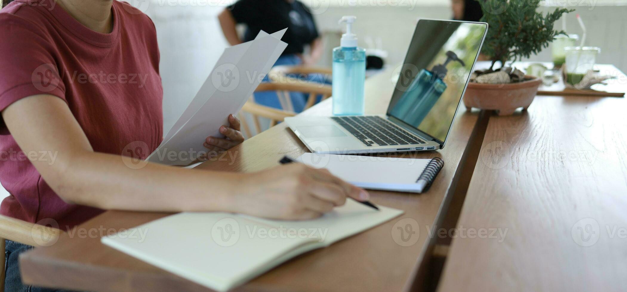 Woman working in cafe wearing protective mask.  coronavirus COVID-19 Social distancing  keep distance in public society people to protect COVID photo