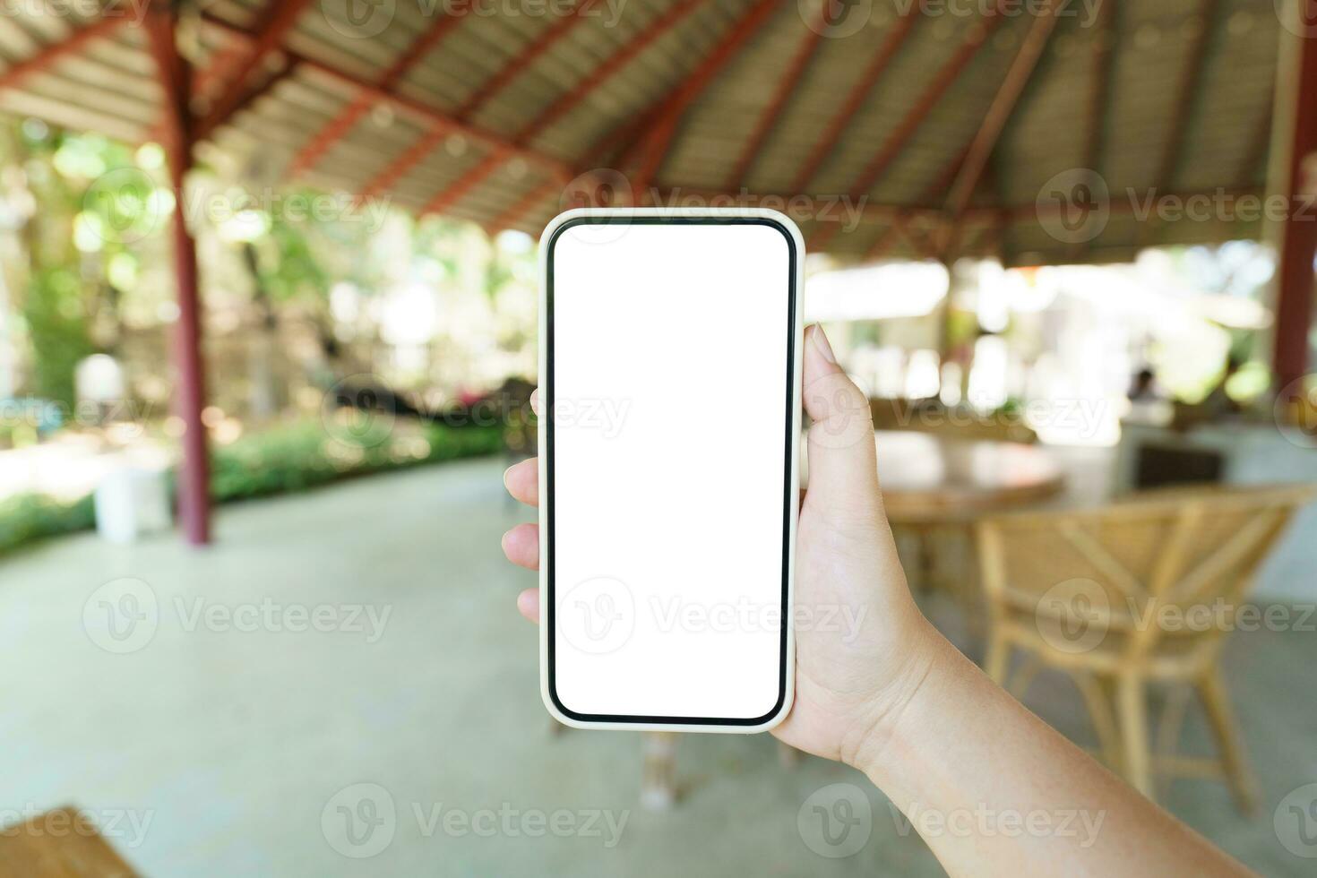 Close up of women's hands holding cell telephone blank copy space screen. smart phone with technology concept photo