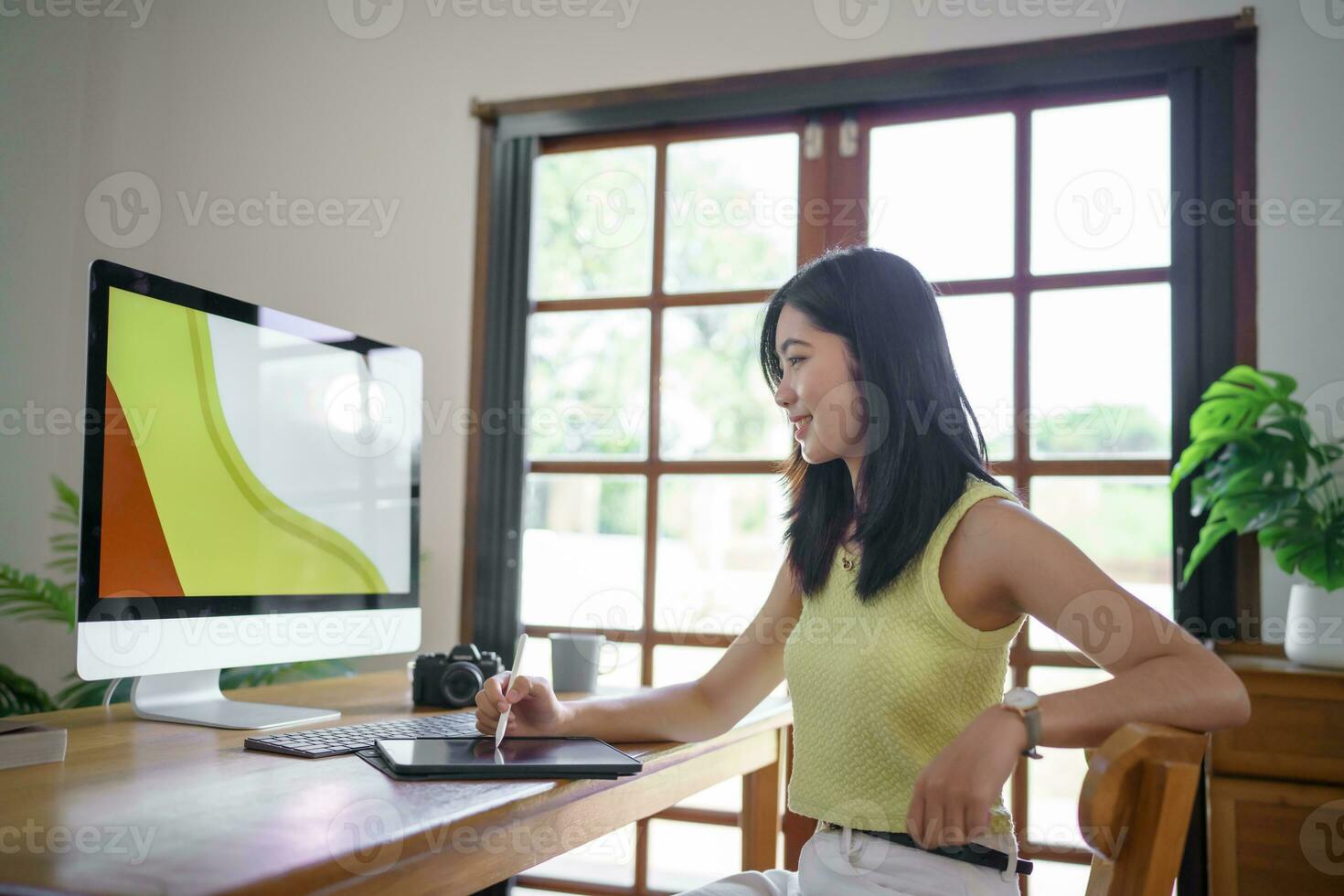 Graphic designer working on digital tablet and computer. Designer Asian Woman artist drawing on graphic tablet  Artist Creative Designer sketch graphic drawing creative photo