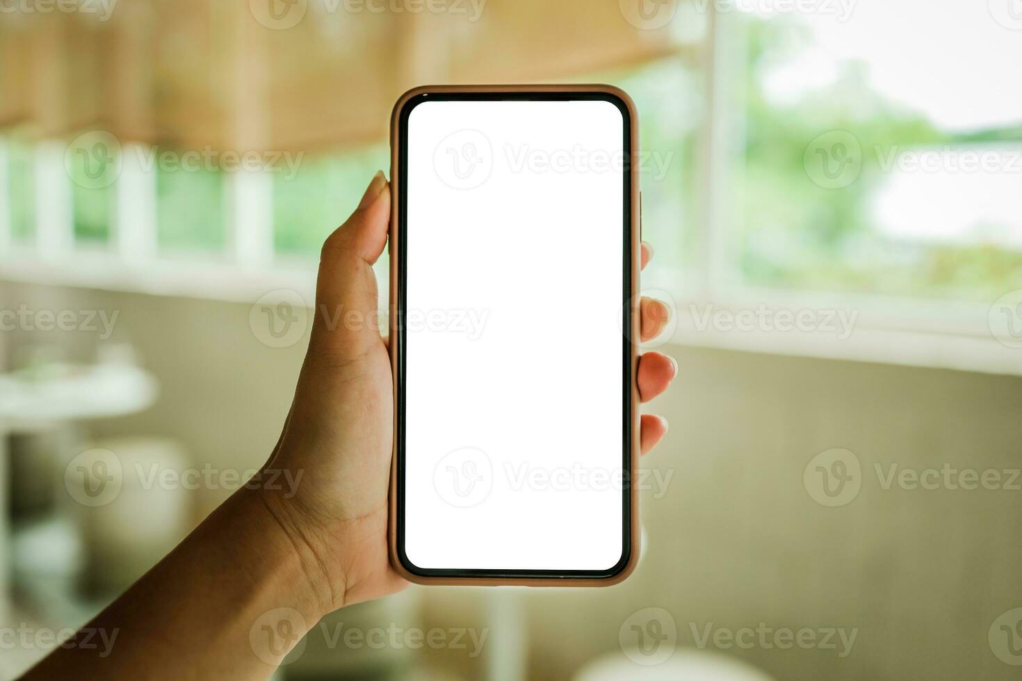 Women's hands holding cell telephone blank copy space screen. smart phone with technology concept photo