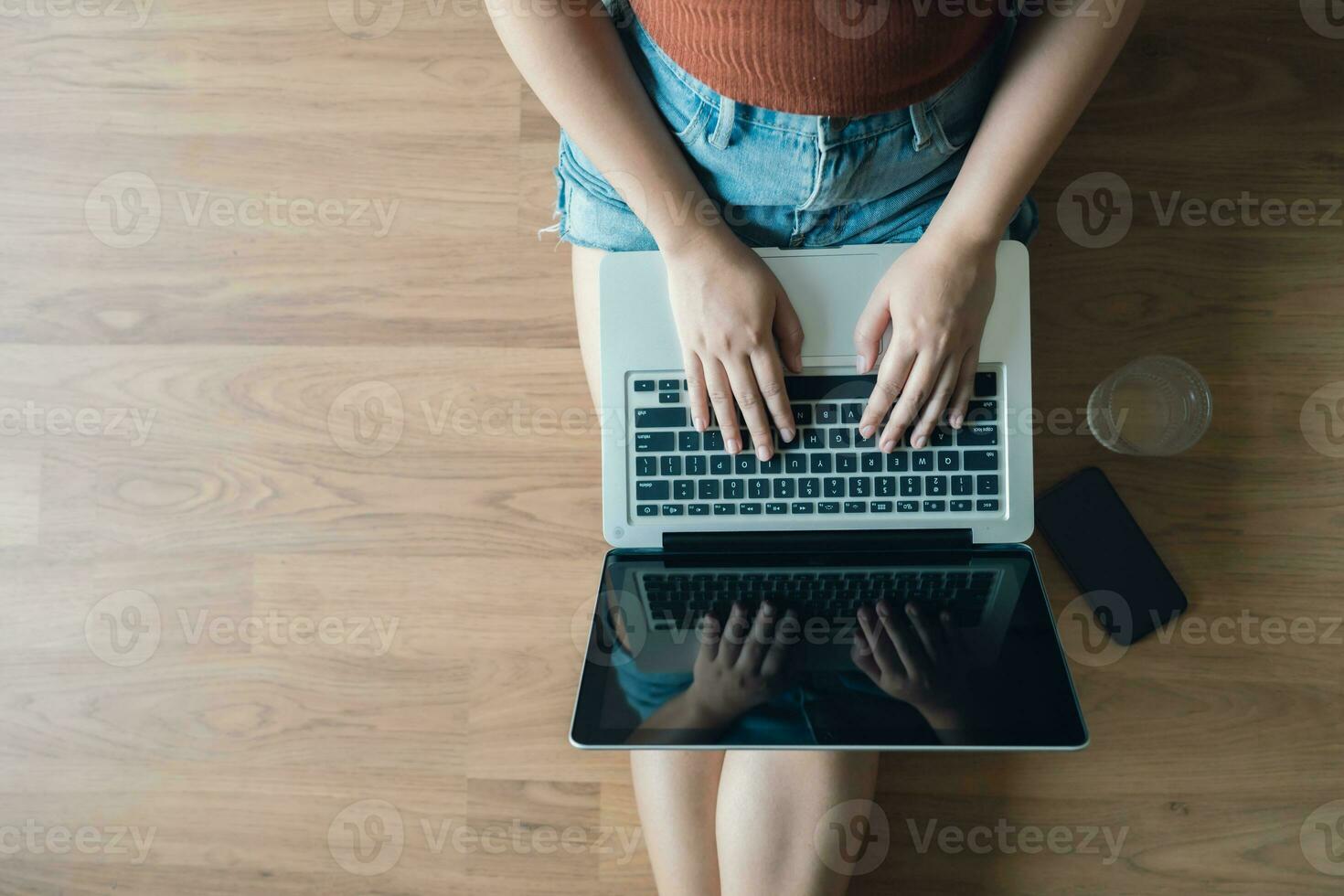 Woman Working by using laptop blank screen computer . Hands typing on a keyboard.technology e-commerce concept. photo