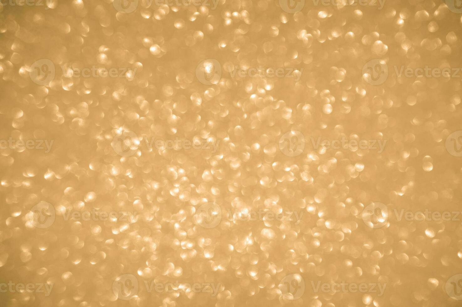 Gold glitters background. shimmering blur spot lights Bokeh Shiny gold light background. photo