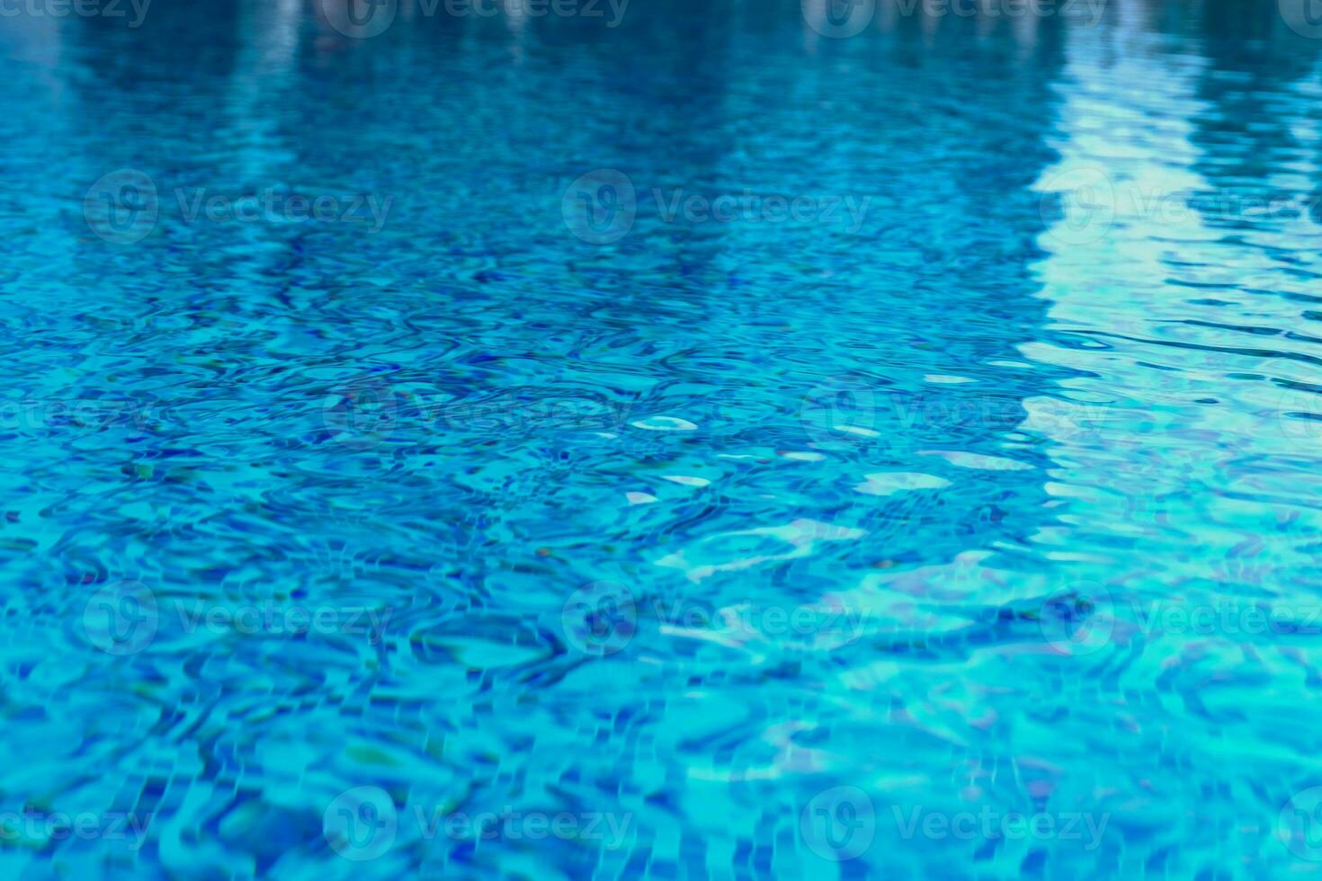 Abstract pool water.  Swimming pool flow with waves background surface of blue swimming pool photo