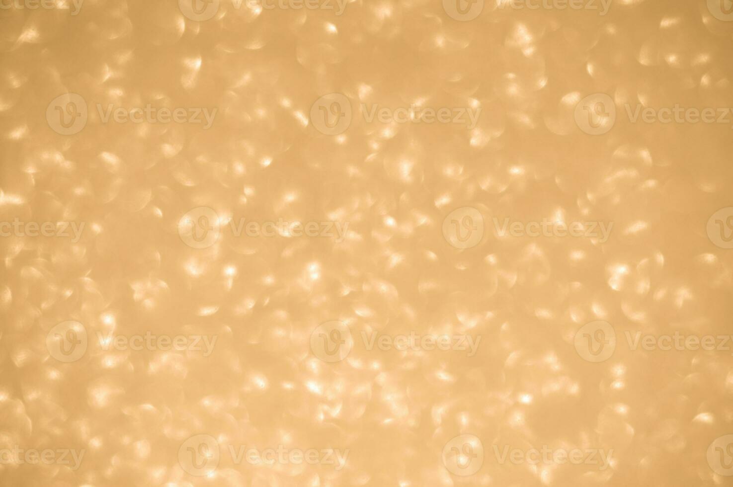 Gold glitters background. shimmering blur spot lights Bokeh Shiny gold light background. photo