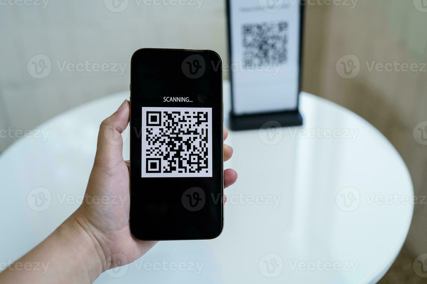 Qr code payment. E wallet. Man scanning tag accepted generate digital pay without money.scanning QR code online shopping cashless payment and verification technology concept. photo