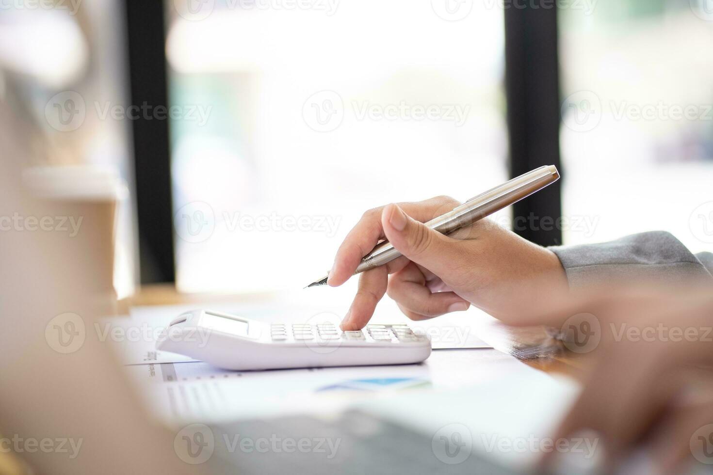 Calculating Cost Economic budget saving and investment concept analyzing investment charts and calculator Accounting Concept photo