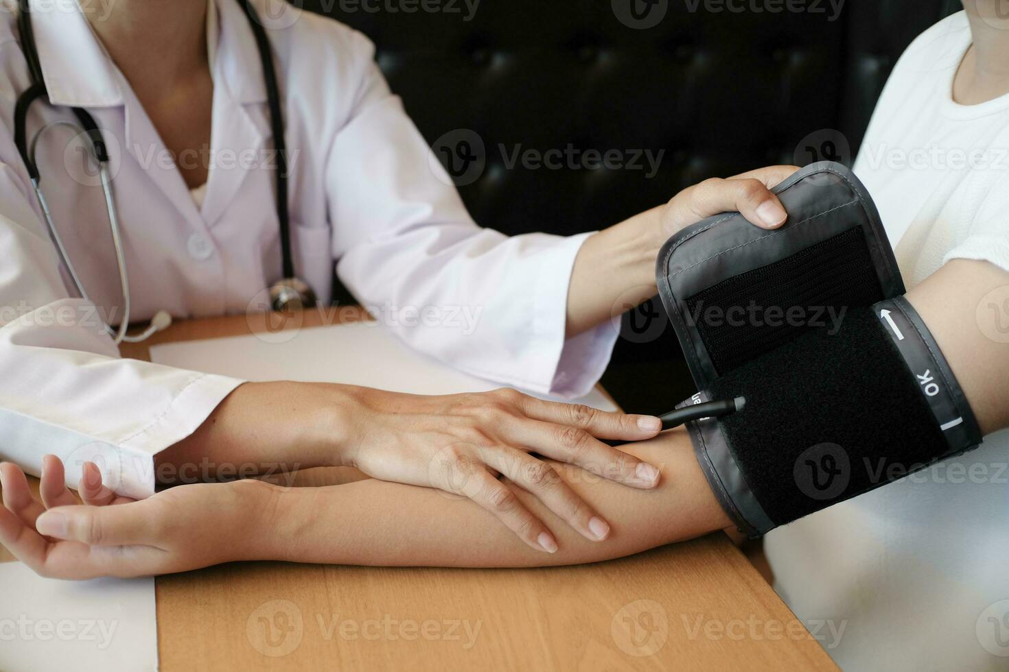 Doctor checking  patient arterial blood pressure. Health care photo