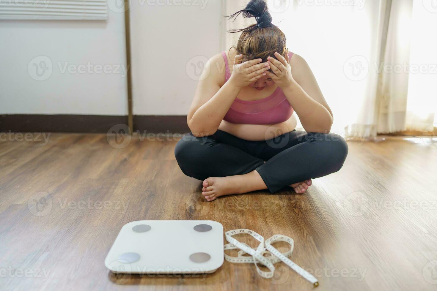 Obese Woman with fat upset about her belly. Overweight woman touching his fat belly and want to lose weight. Fat woman worried about weight diet lifestyle. photo