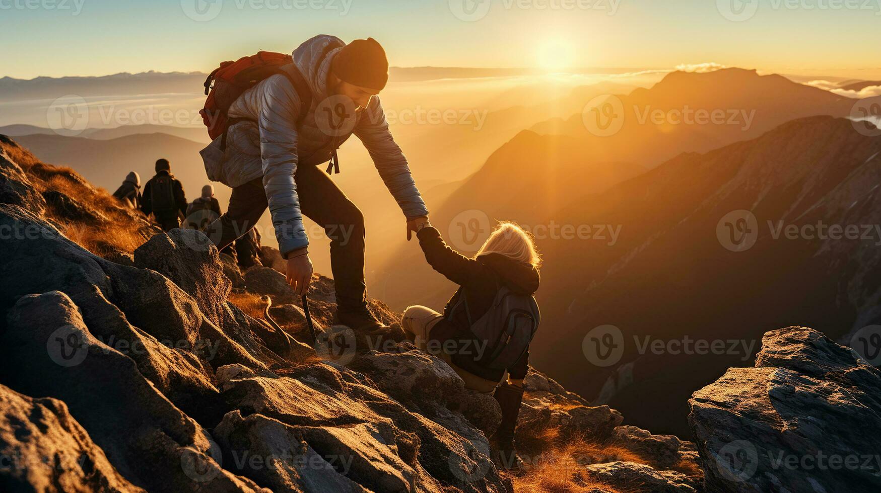 Helping each other, friend giving a helping hand while climbing up on the mountain rock. adventure travel concept of friendship support trust, teamwork success. photo